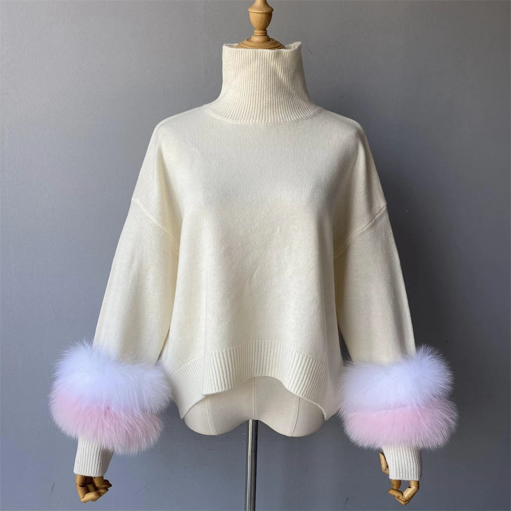 White sweater with pink and purple fur cuffs on a mannequin against a gray background