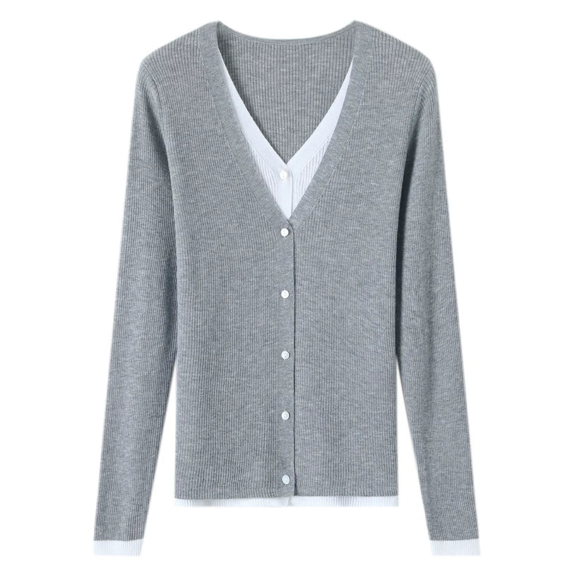 Gray cardigan with white buttons on a white background