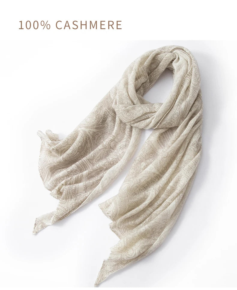 Beige cashmere scarf on a white background with '100% Cashmere' text.
