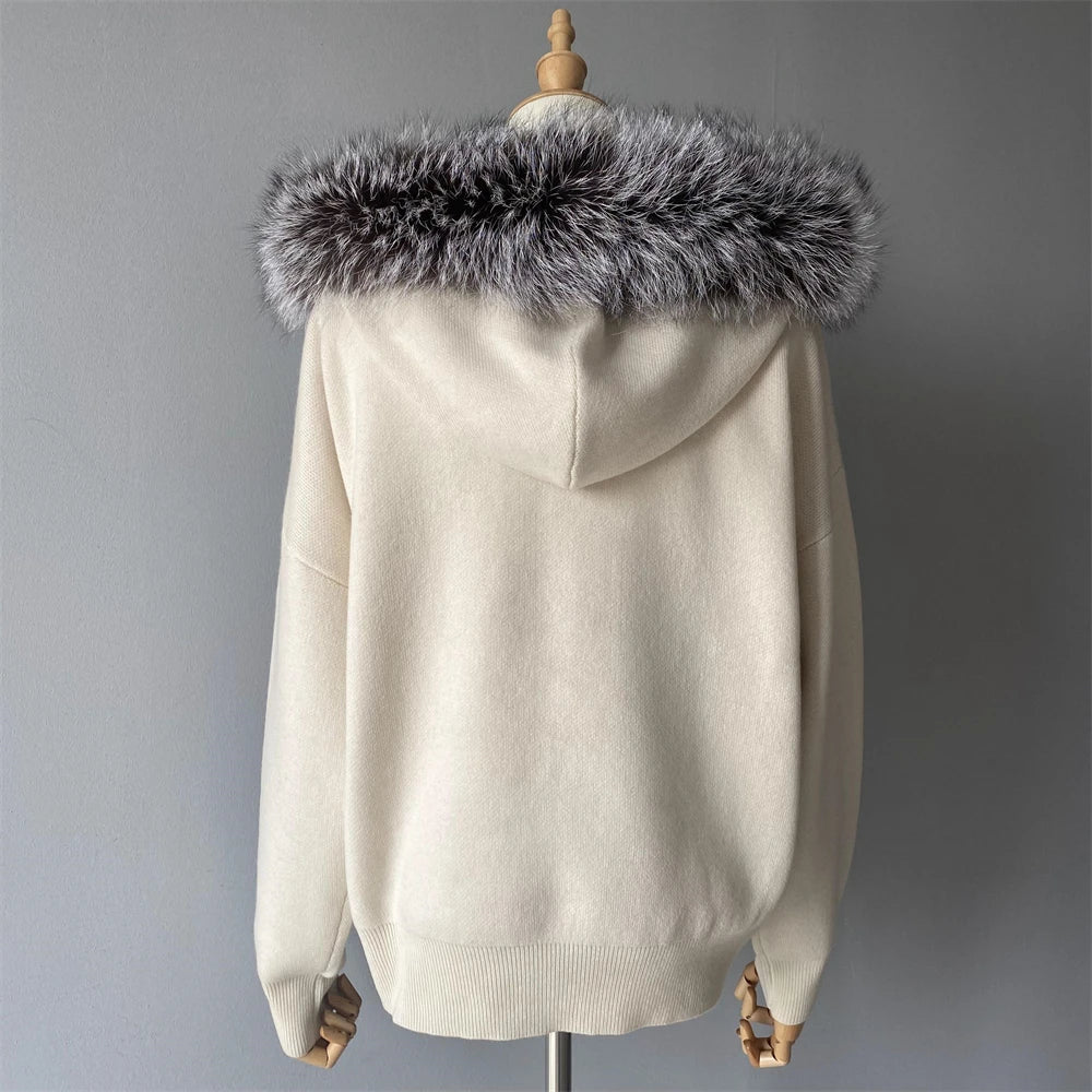 Beige hoodie with a fur-lined hood on a mannequin against a gray background