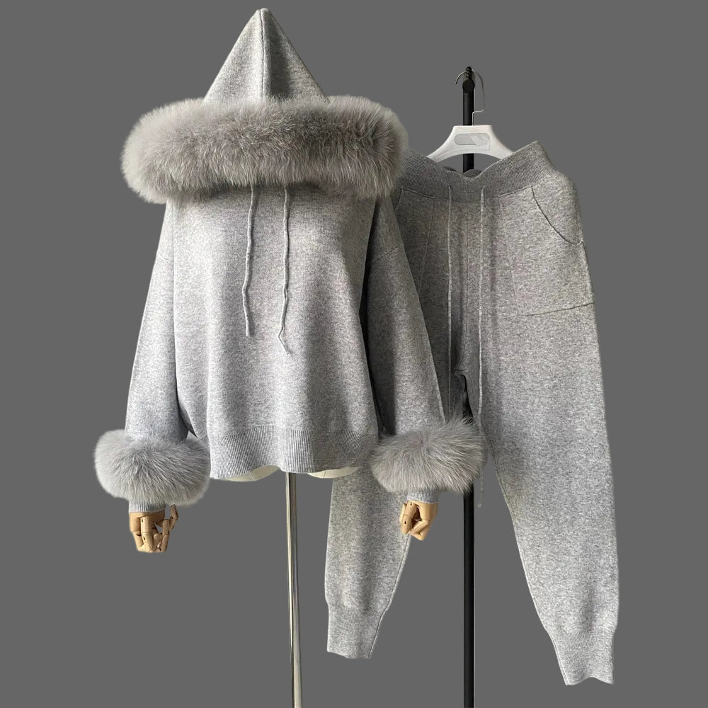 Gray hoodie with fur trim on a mannequin against a plain background
