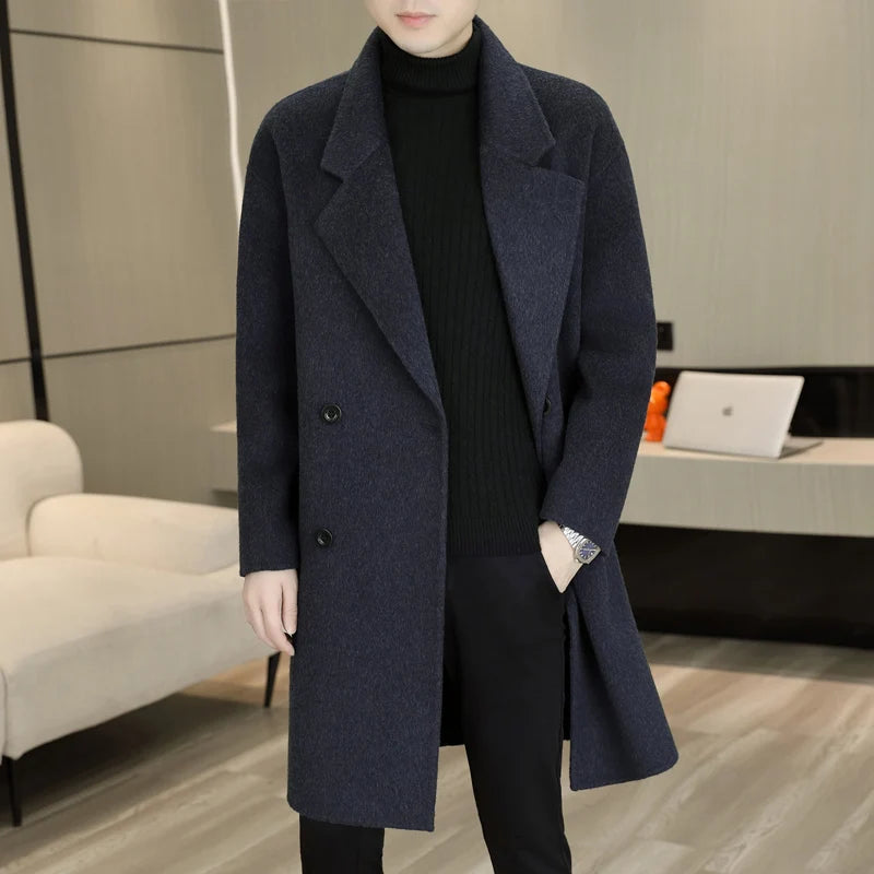 Person wearing a dark blue coat in an indoor setting