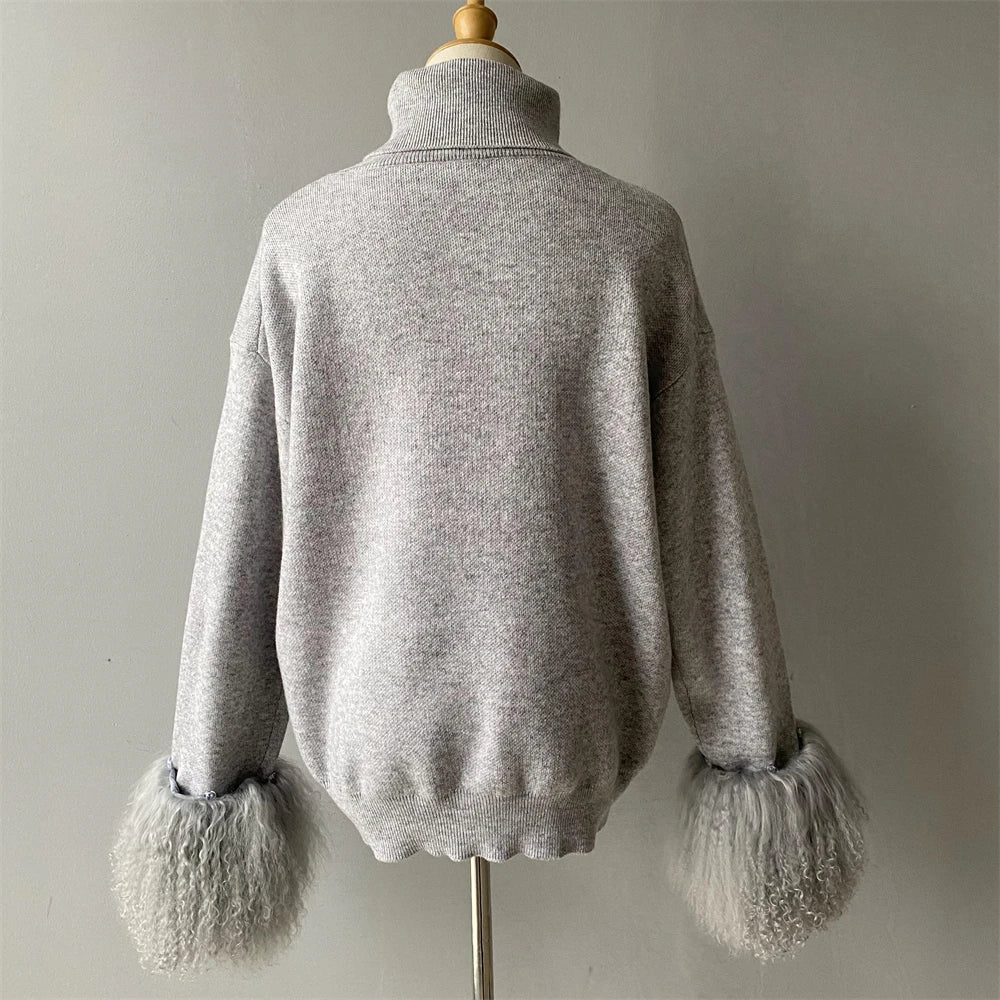 Gray sweater with fur cuffs on a mannequin against a neutral background
