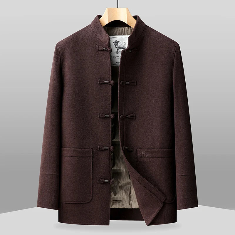 Brown coat on a hanger against a gray background