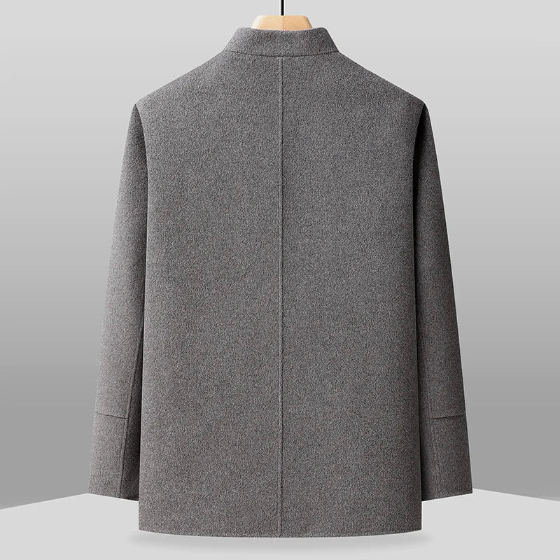 Gray coat on a mannequin against a gray background