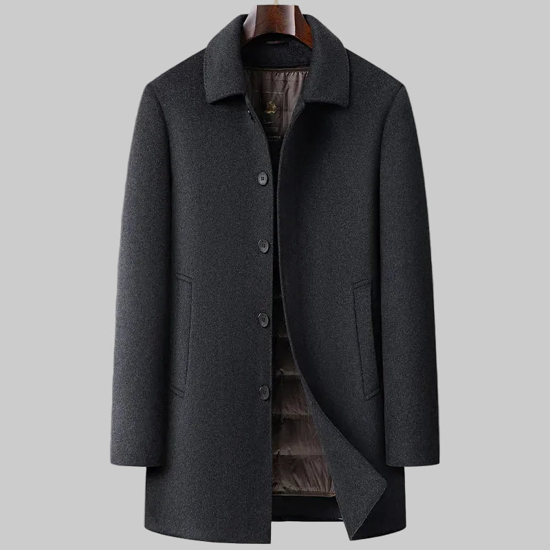 Gray overcoat on a hanger against a gray background