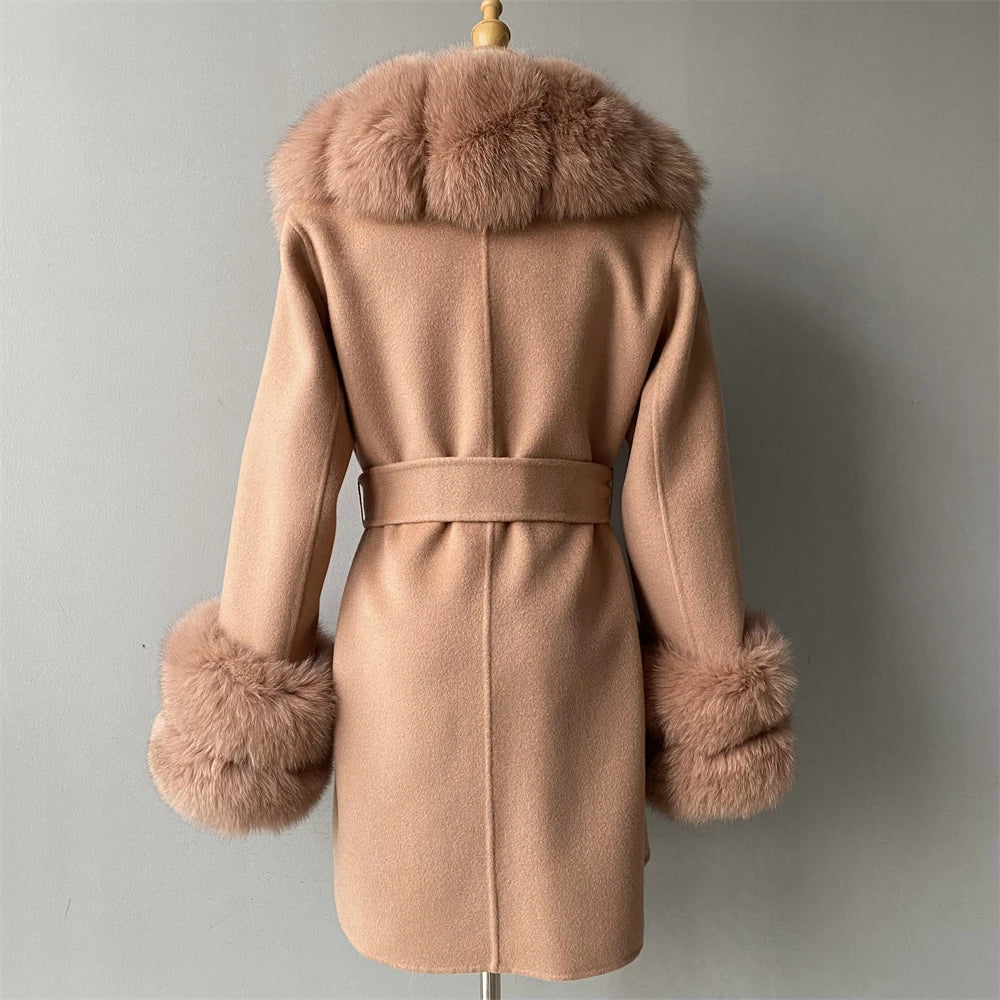 Beige coat with fur trim on a mannequin against a plain background