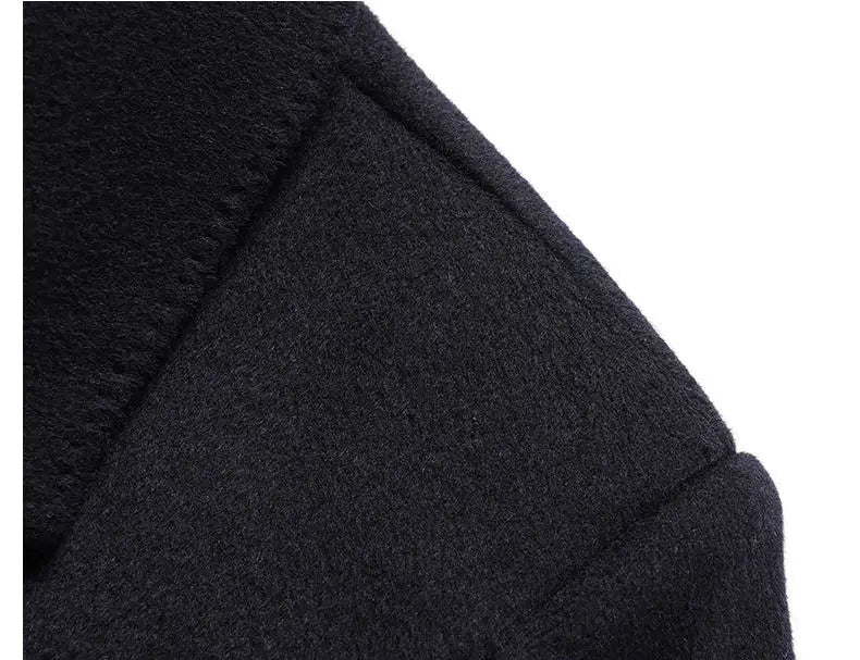 Close-up of a dark coat with text on a black background