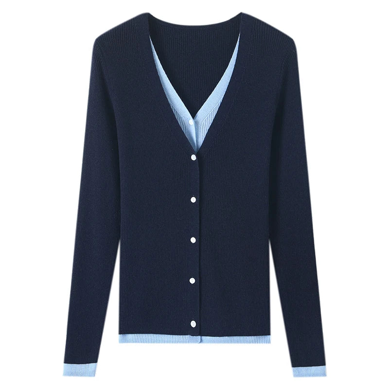 Navy blue cardigan with light blue trim on a white background