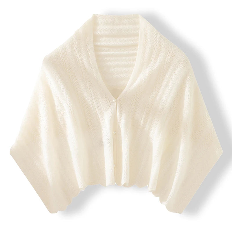 Cream-colored knitted shawl on a white background