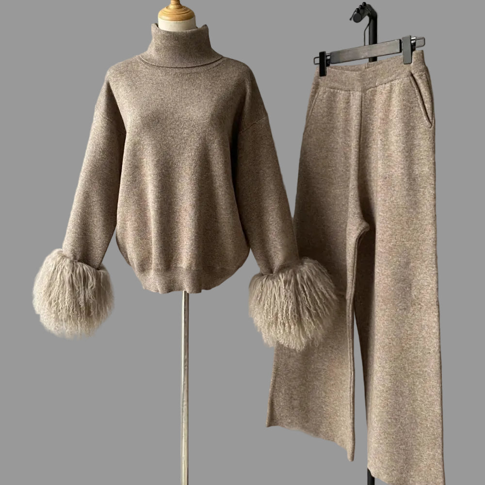 Beige sweater and pants set with fluffy cuffs on a gray background