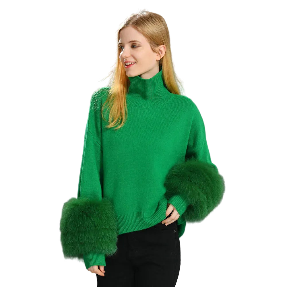 Woman wearing a green sweater with fur cuffs on a gray background