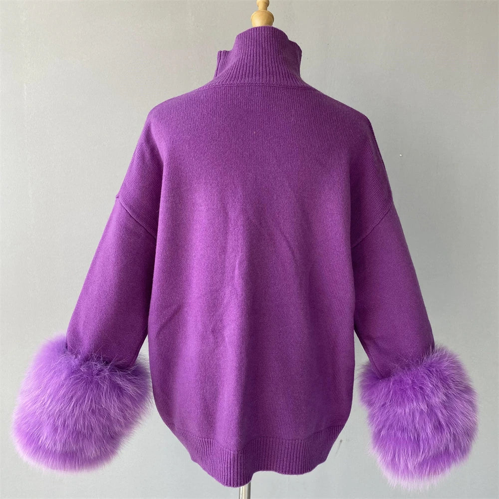 Purple sweater with fur cuffs on a mannequin against a plain background