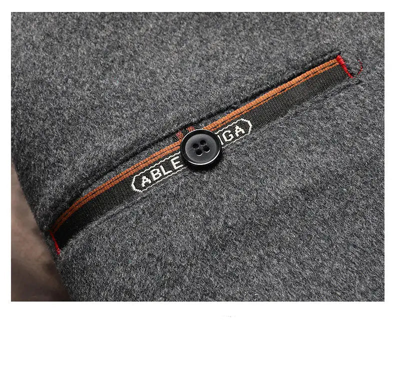 Gray fabric with a button and 'ABLE' brand label on a dark background