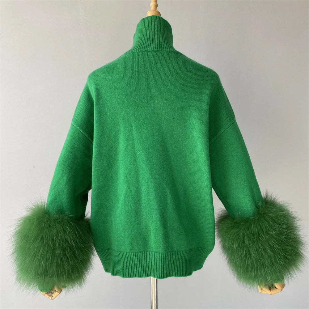 Green sweater with fur cuffs on a mannequin against a plain background