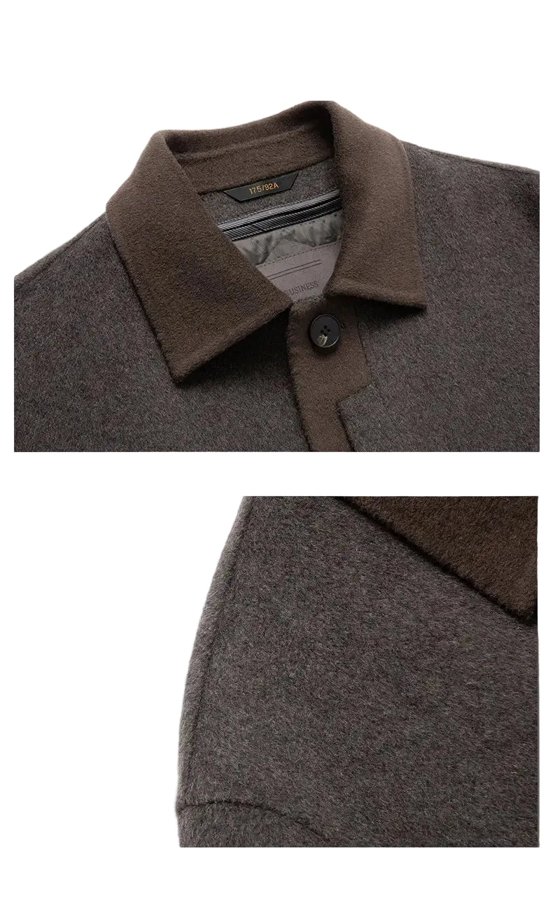 Close-up of a brown and gray coat with a focus on the collar and texture.