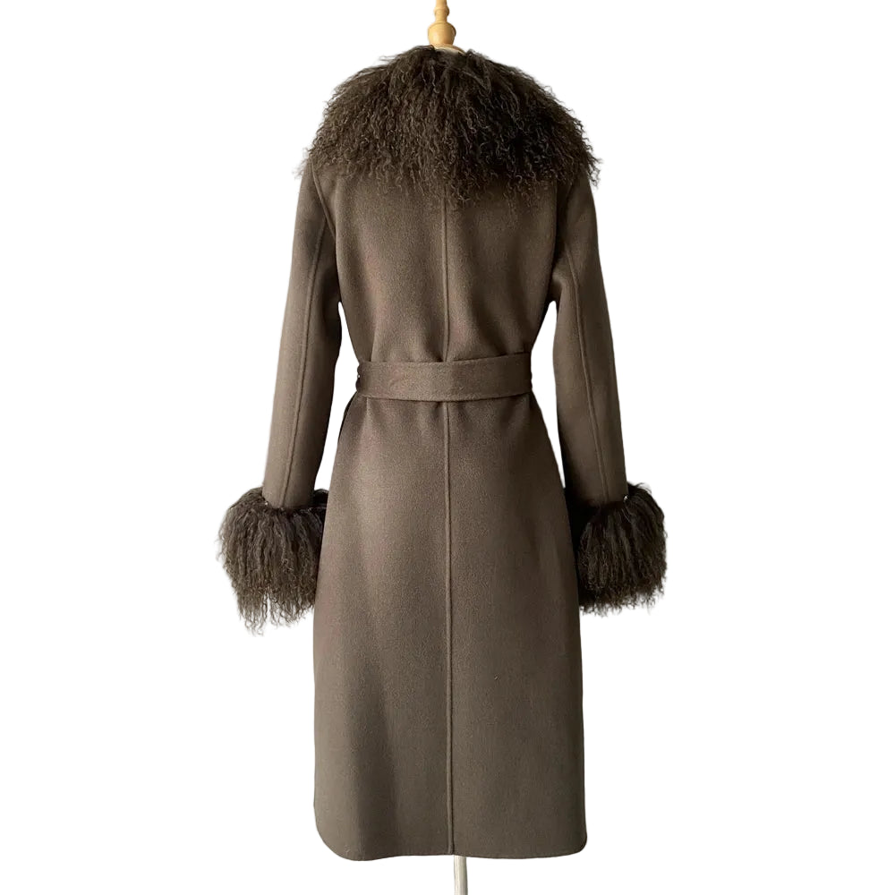 Brown coat with fur trim on a mannequin against a plain background