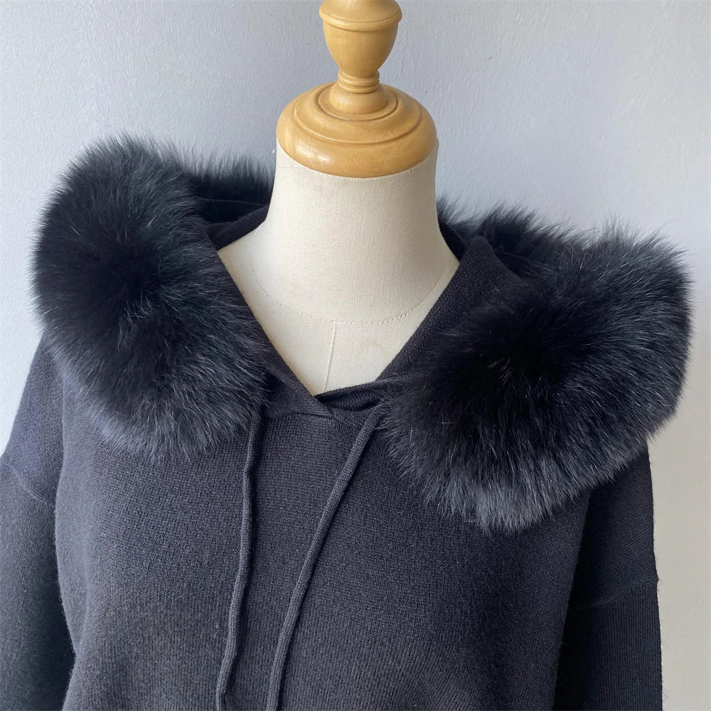 Gray coat with fur collar on a mannequin against a plain background