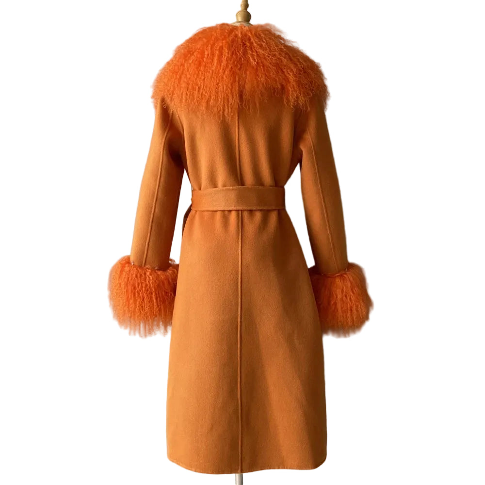 Orange coat with fur trim on a mannequin against a gray background