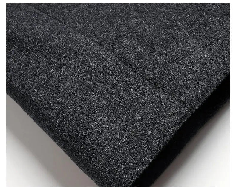 Close-up of dark gray fabric with a textured surface on a white background
