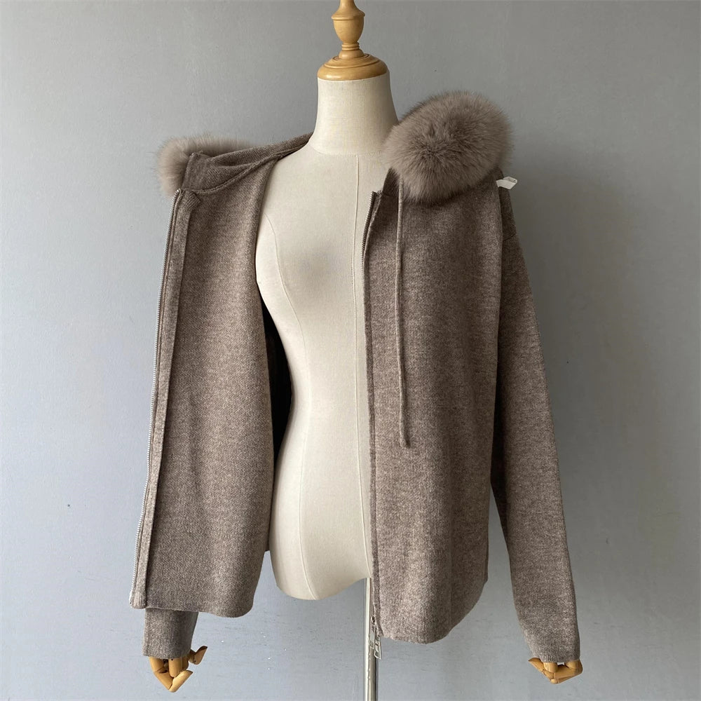 Brown hooded jacket with fur trim on a mannequin against a gray background