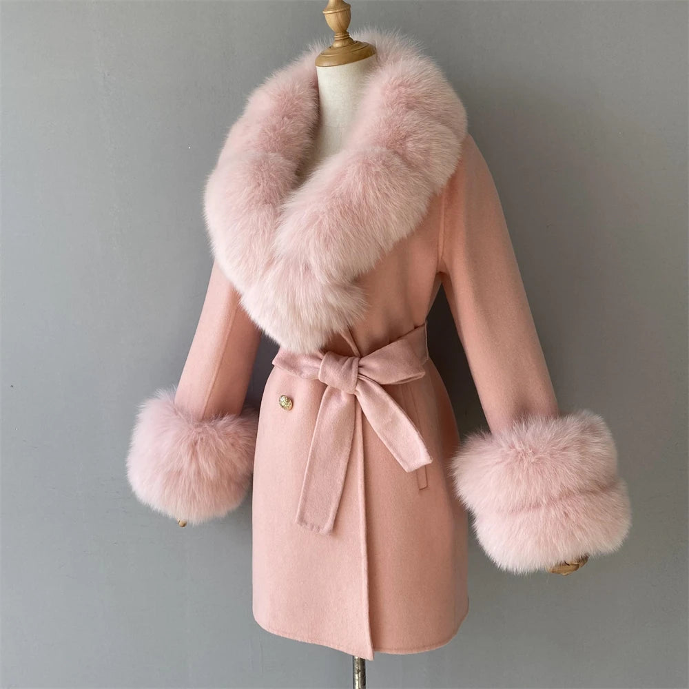 Pink coat with fur trim on a mannequin against a gray background