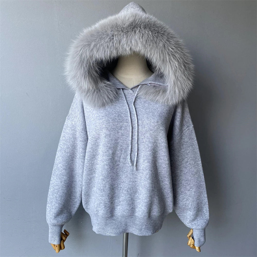 Gray hoodie with fur-lined hood on a mannequin against a gray background