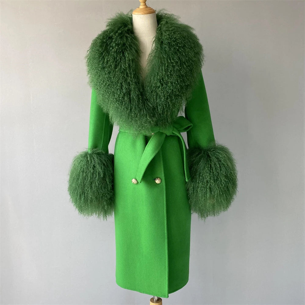 Green coat with fur accents on a mannequin against a plain background