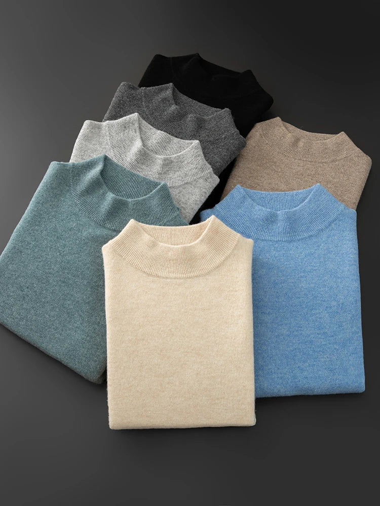 Folded sweaters in various colors on a dark background