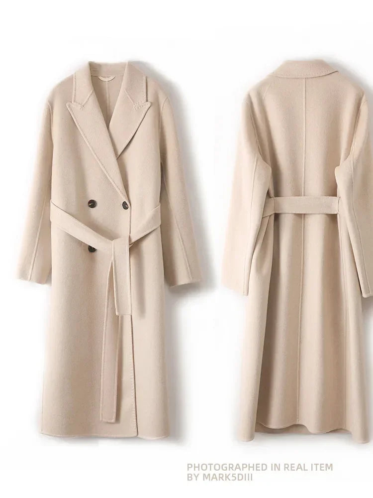 Beige trench coat with a belt on a white background