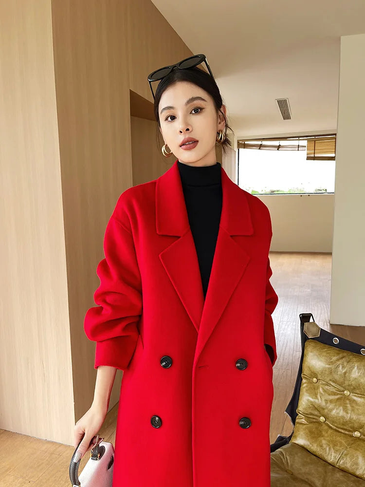 Woman wearing a red coat in an indoor setting