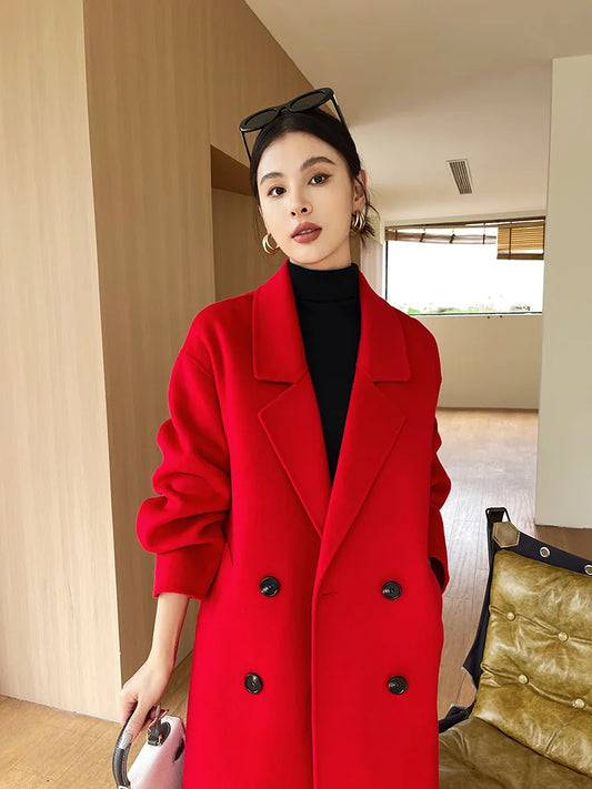 Woman wearing a red coat in an indoor setting