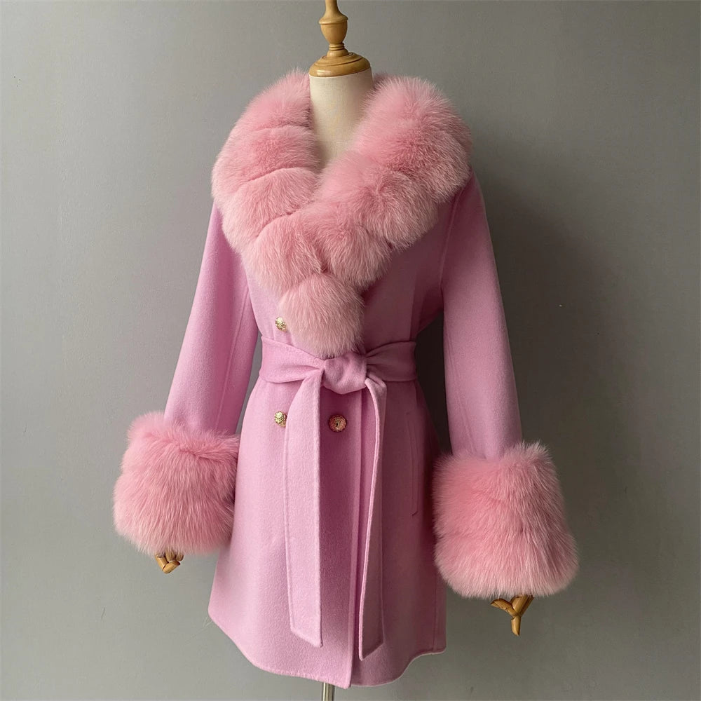 Pink coat with fur trim on a mannequin against a gray background