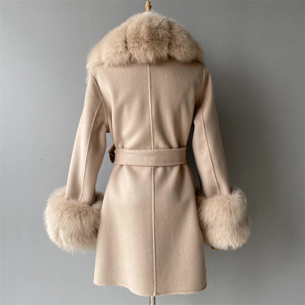 Beige coat with fur trim on a gray background