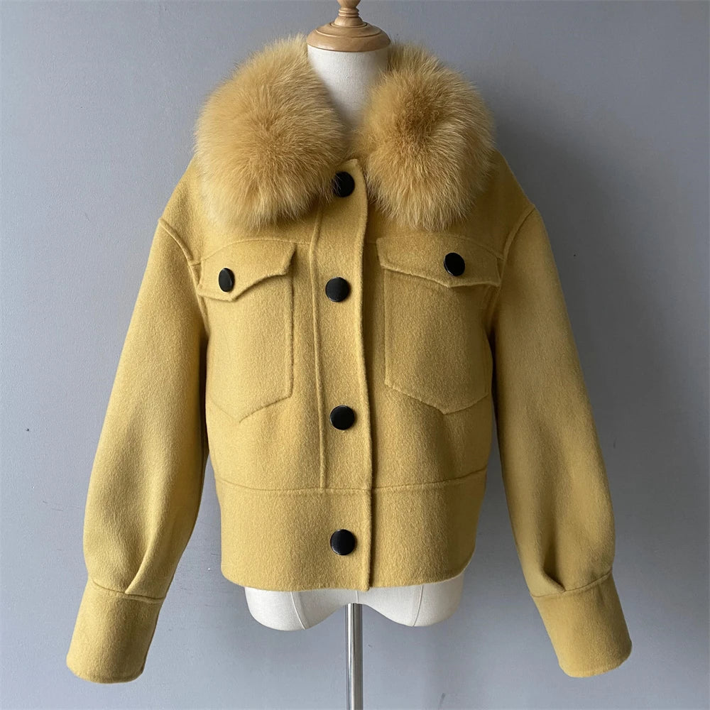 Yellow jacket with fur collar on a mannequin against a gray background