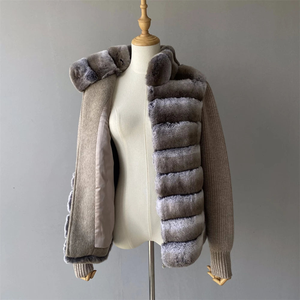 Brown jacket with fur trim on a mannequin against a gray background