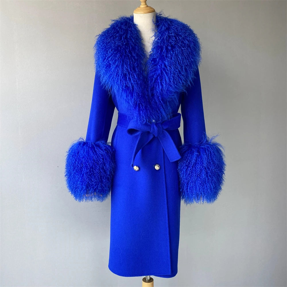 Blue coat with feathered cuffs and collar on a mannequin against a plain background
