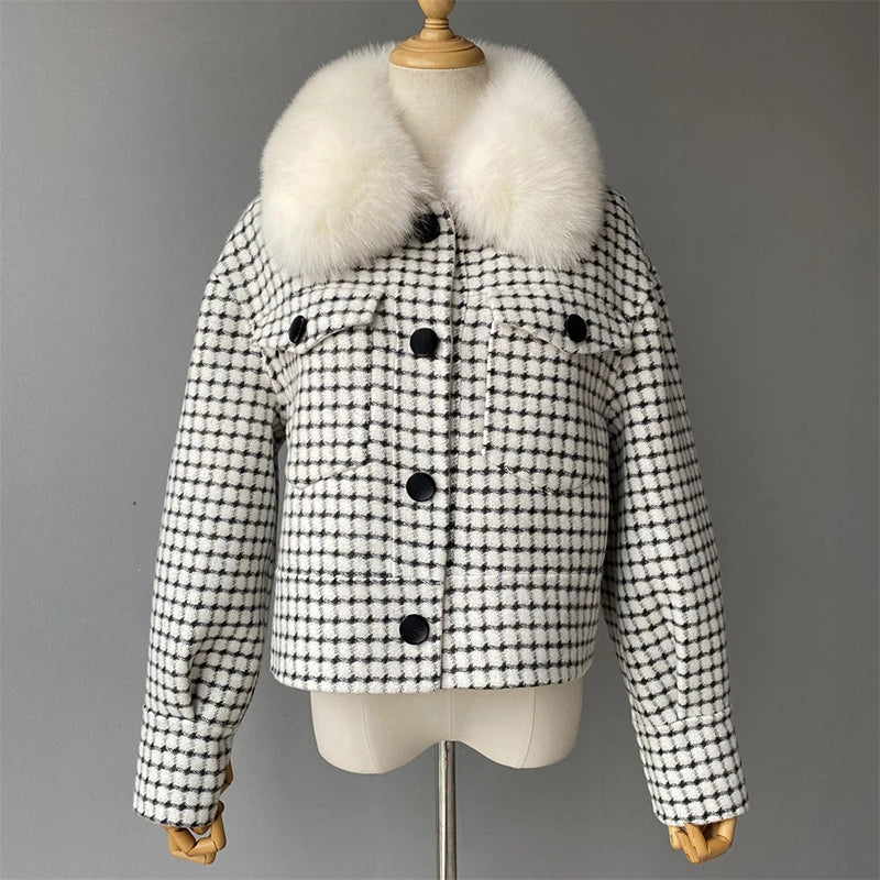 Black and white checkered jacket with fur collar on a mannequin against a gray background