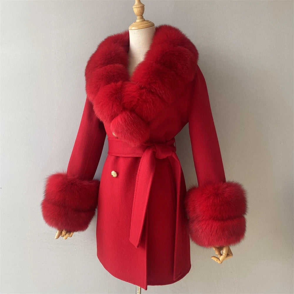 Red coat with fur trim on a mannequin against a plain background