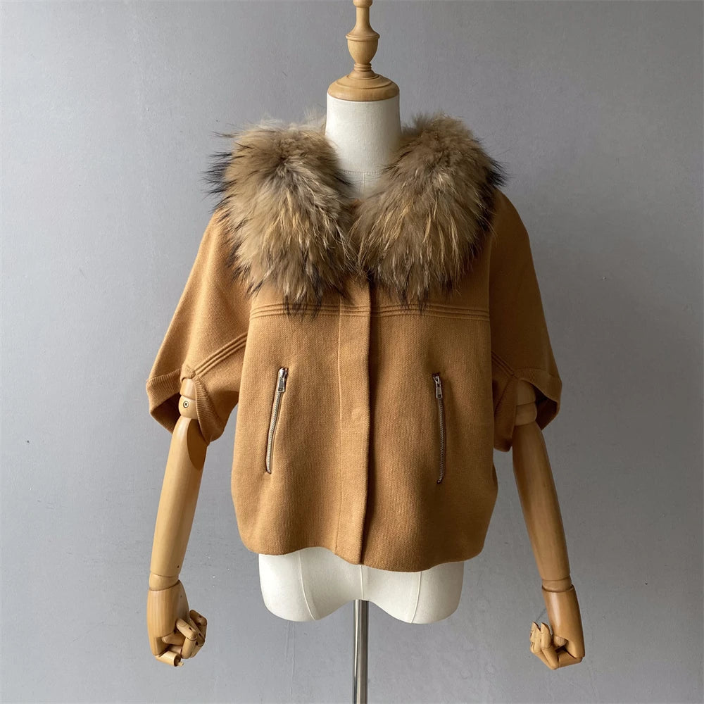 Brown jacket with fur collar on a mannequin against a gray background