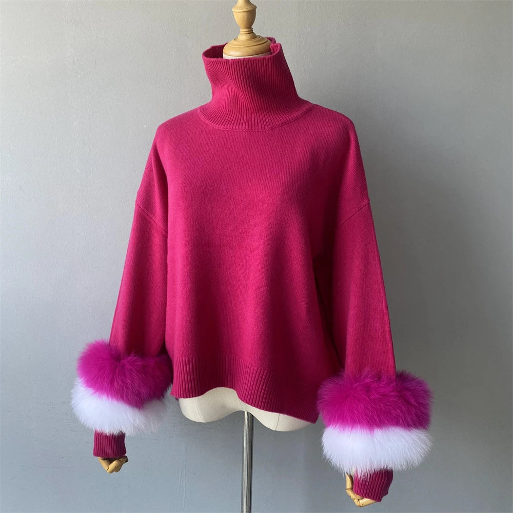 Pink sweater with fur cuffs on a mannequin against a plain background