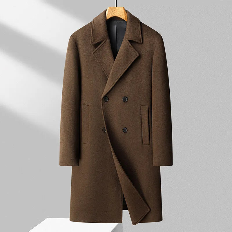 Brown coat on a hanger against a gray background