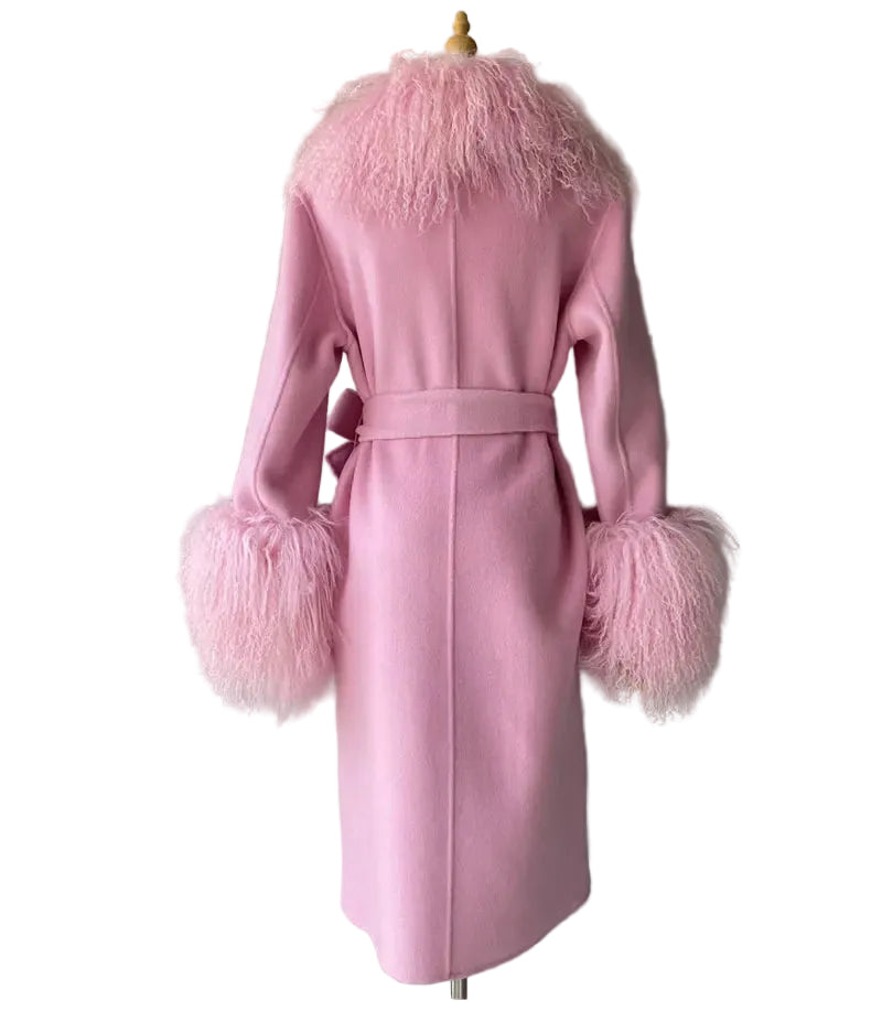 Pink coat with feathered cuffs and collar on a mannequin against a gray background