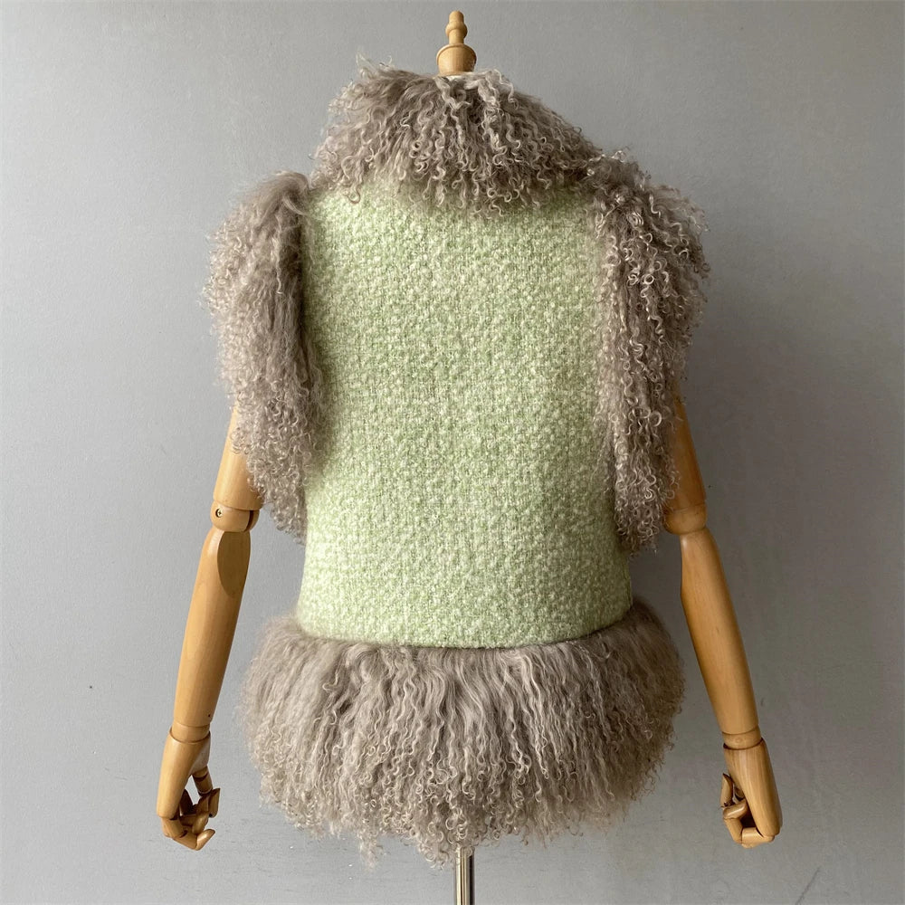 Mannequin wearing a light green knitted top with gray fluffy trim against a plain background