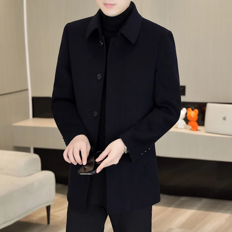 Person wearing a black coat in an indoor setting