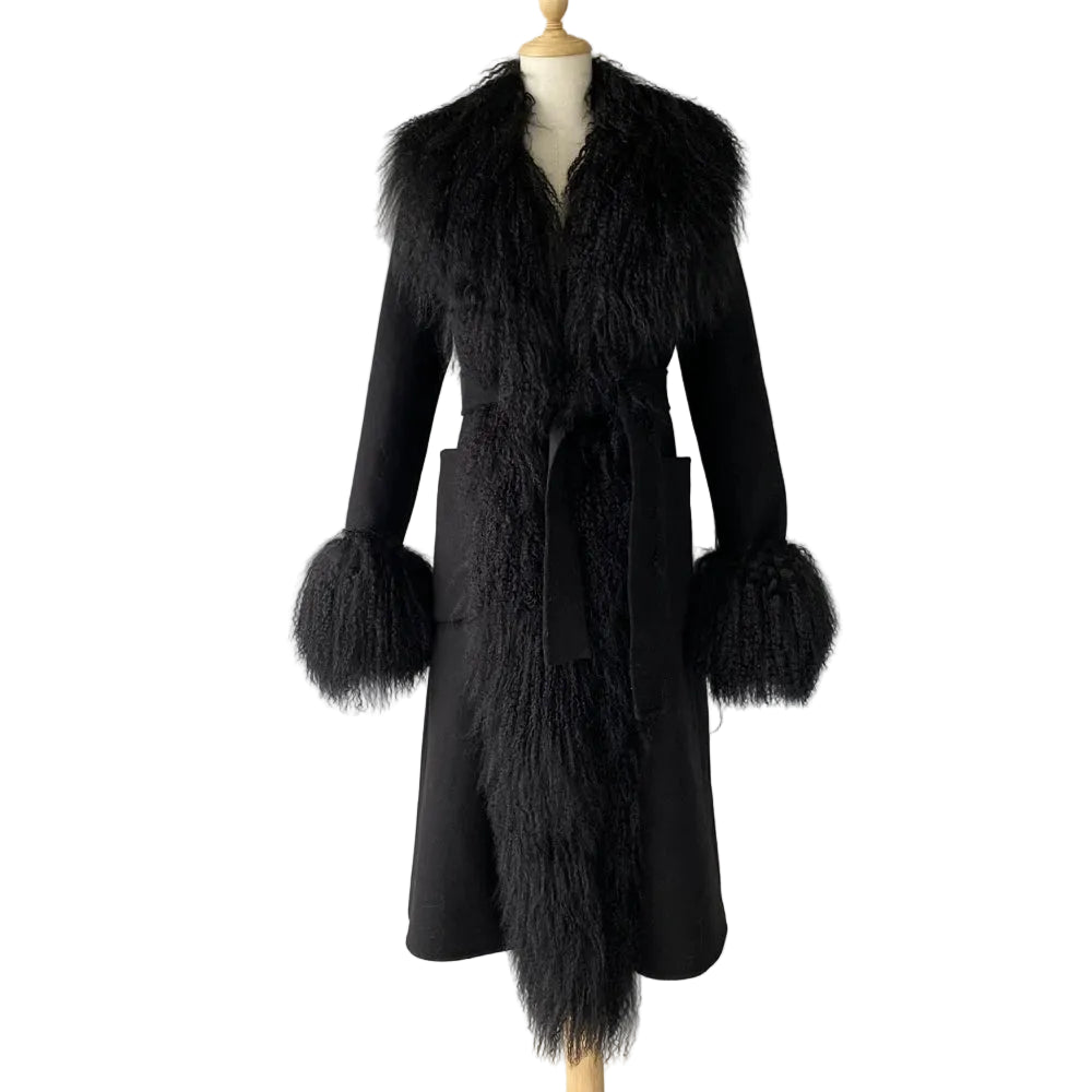Black coat with fur trim on a mannequin against a plain background