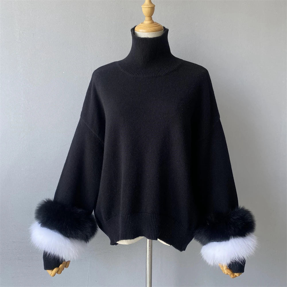 Black sweater with fur cuffs on a mannequin against a plain background