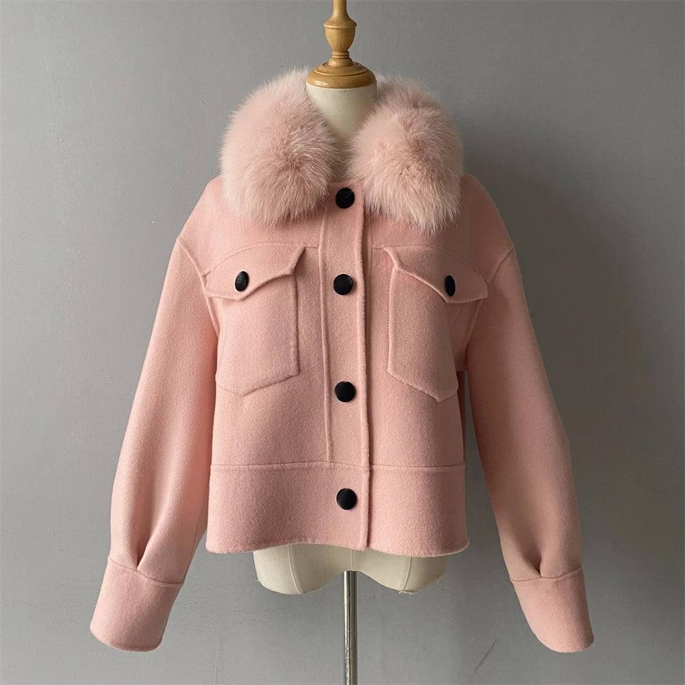 Pink jacket with fur collar on a mannequin against a gray background