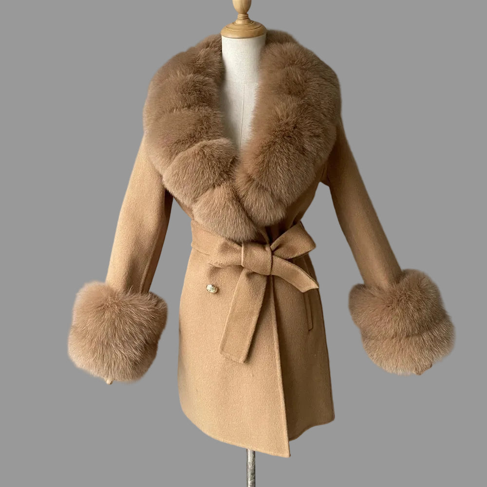 Beige coat with fur collar and cuffs on a mannequin against a gray background