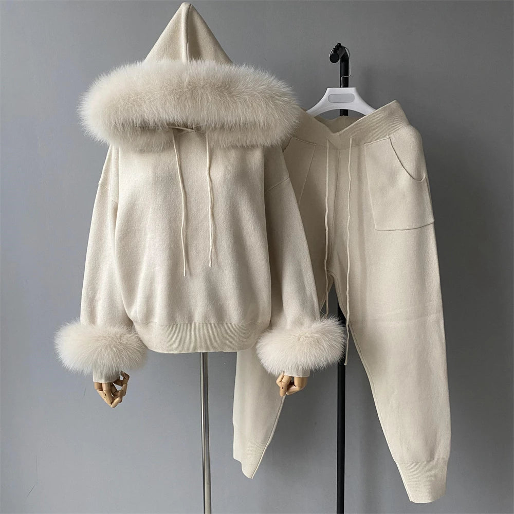 Beige hoodie with fur trim on a gray background